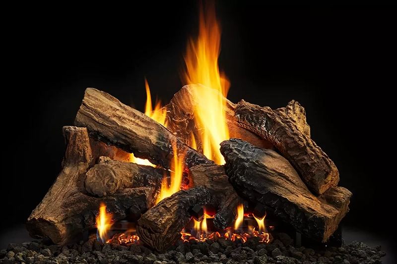 Close up shot of a fire lit on pieces of wood